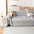 Sofaüberwurf mit Quasten